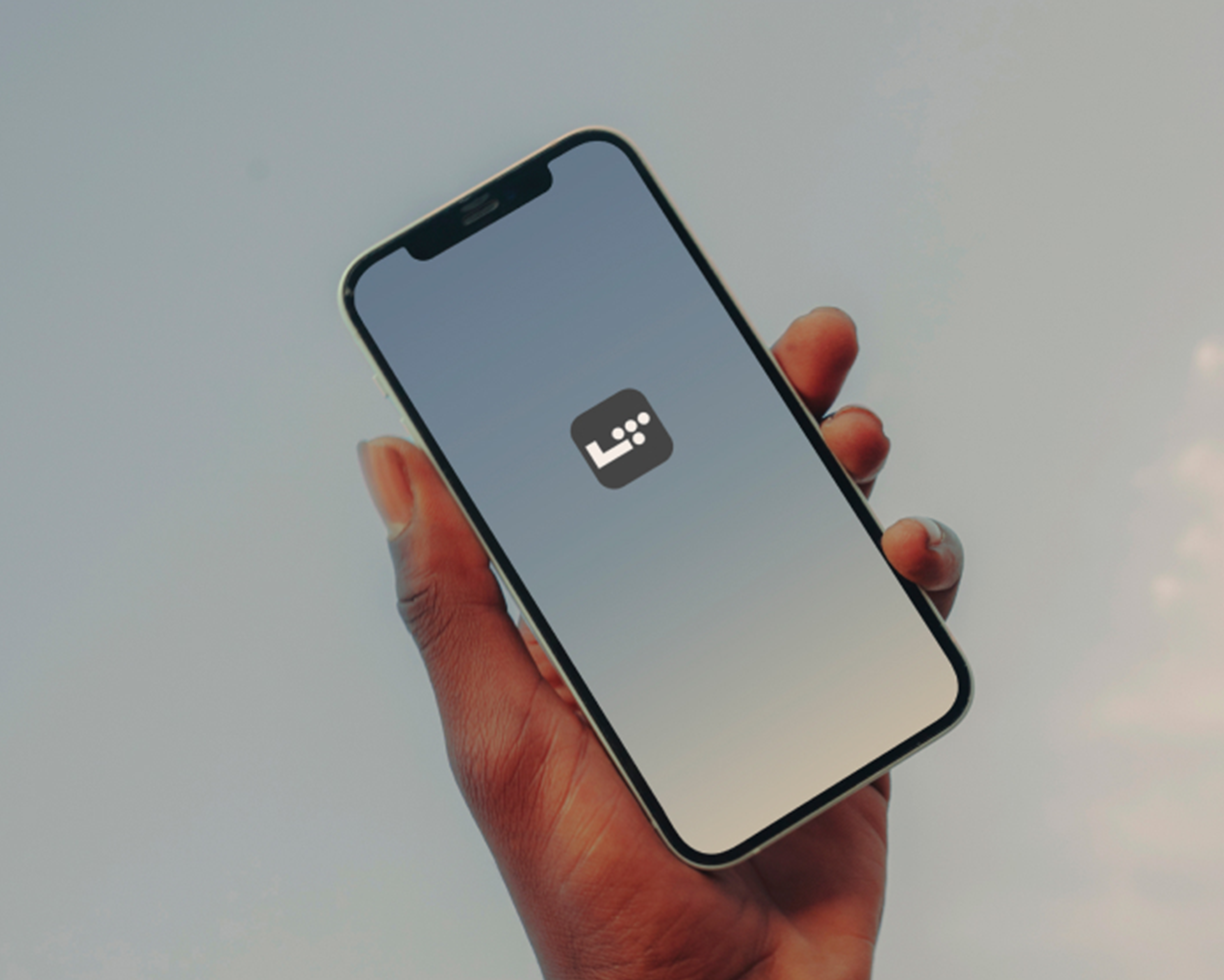 hand holding a phone with the life time app