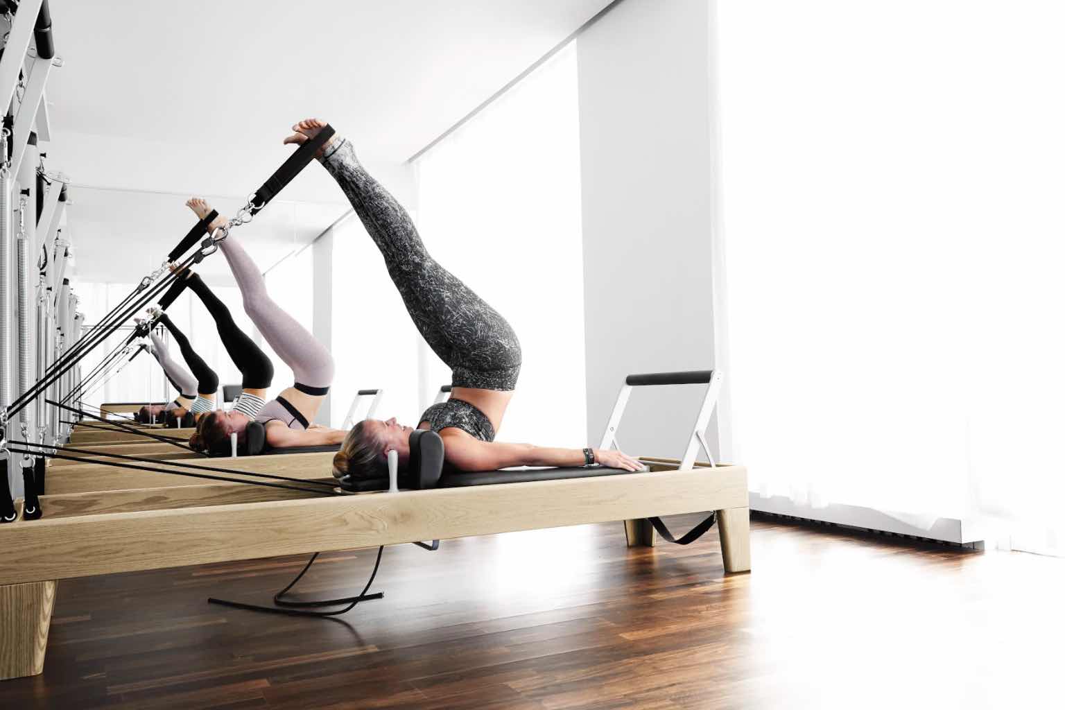 a group of women in a pilates class