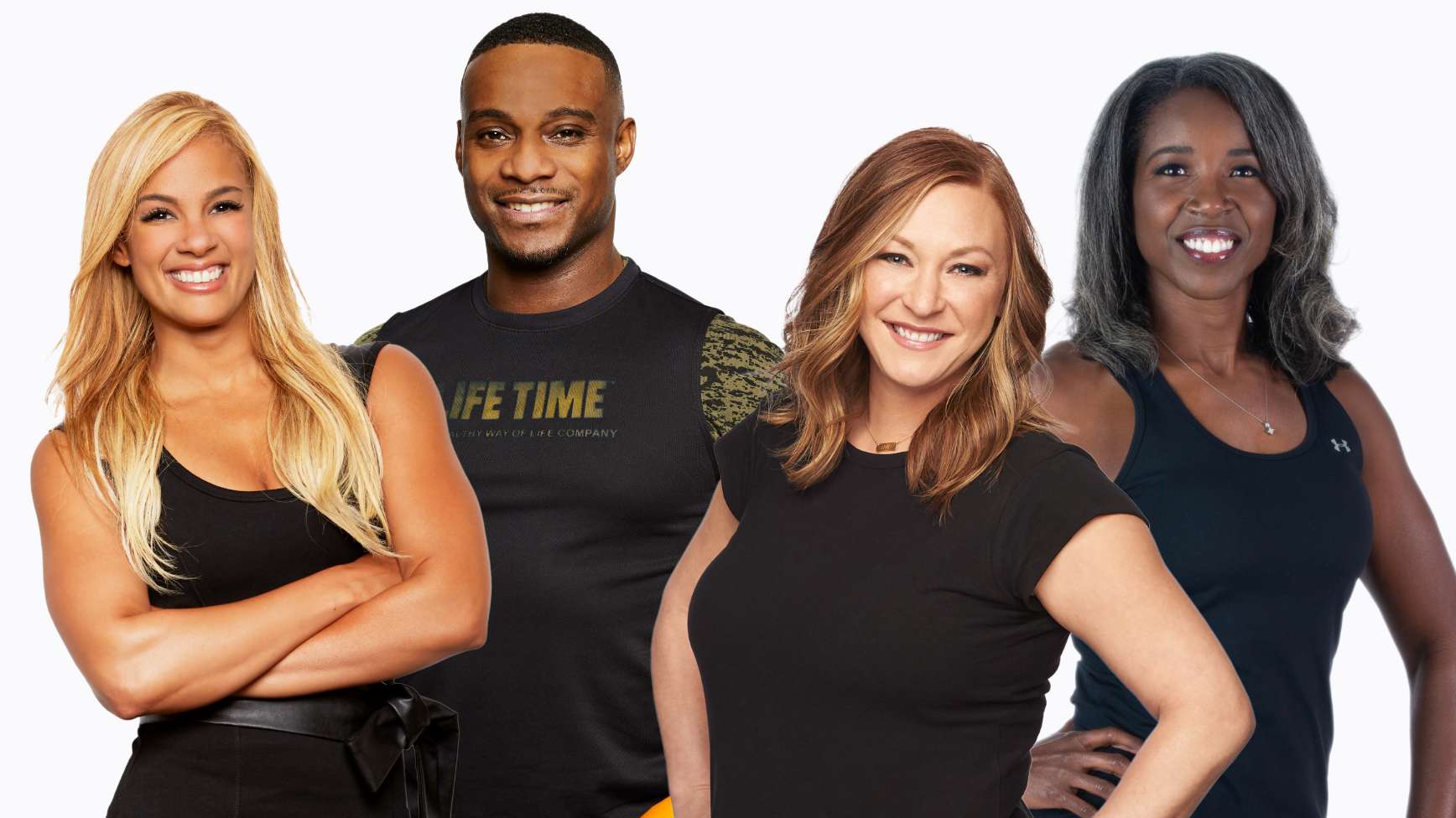 A group of 4 Life Time instructors, smiling, wearing black shirts