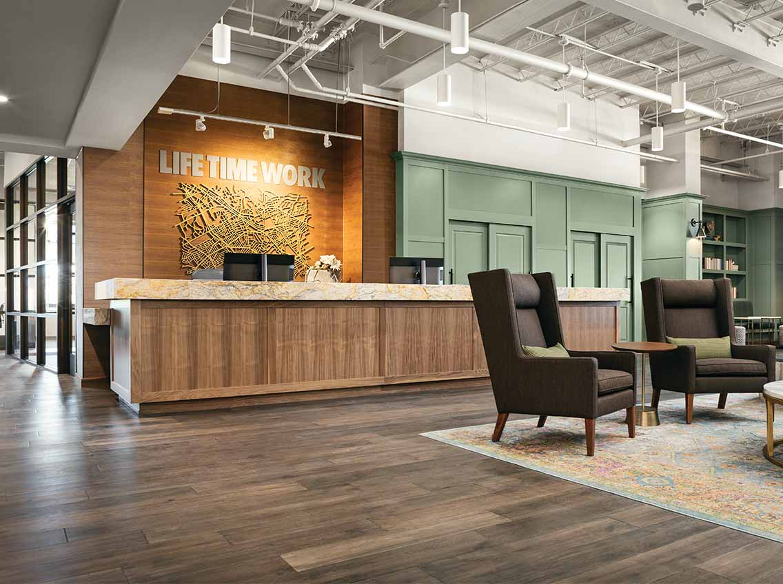 The reception and lounge area at Life Time Work Coral Gables