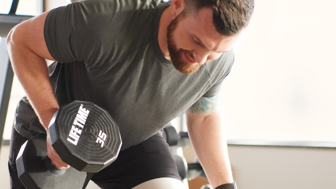 a man lifts a dumbbell