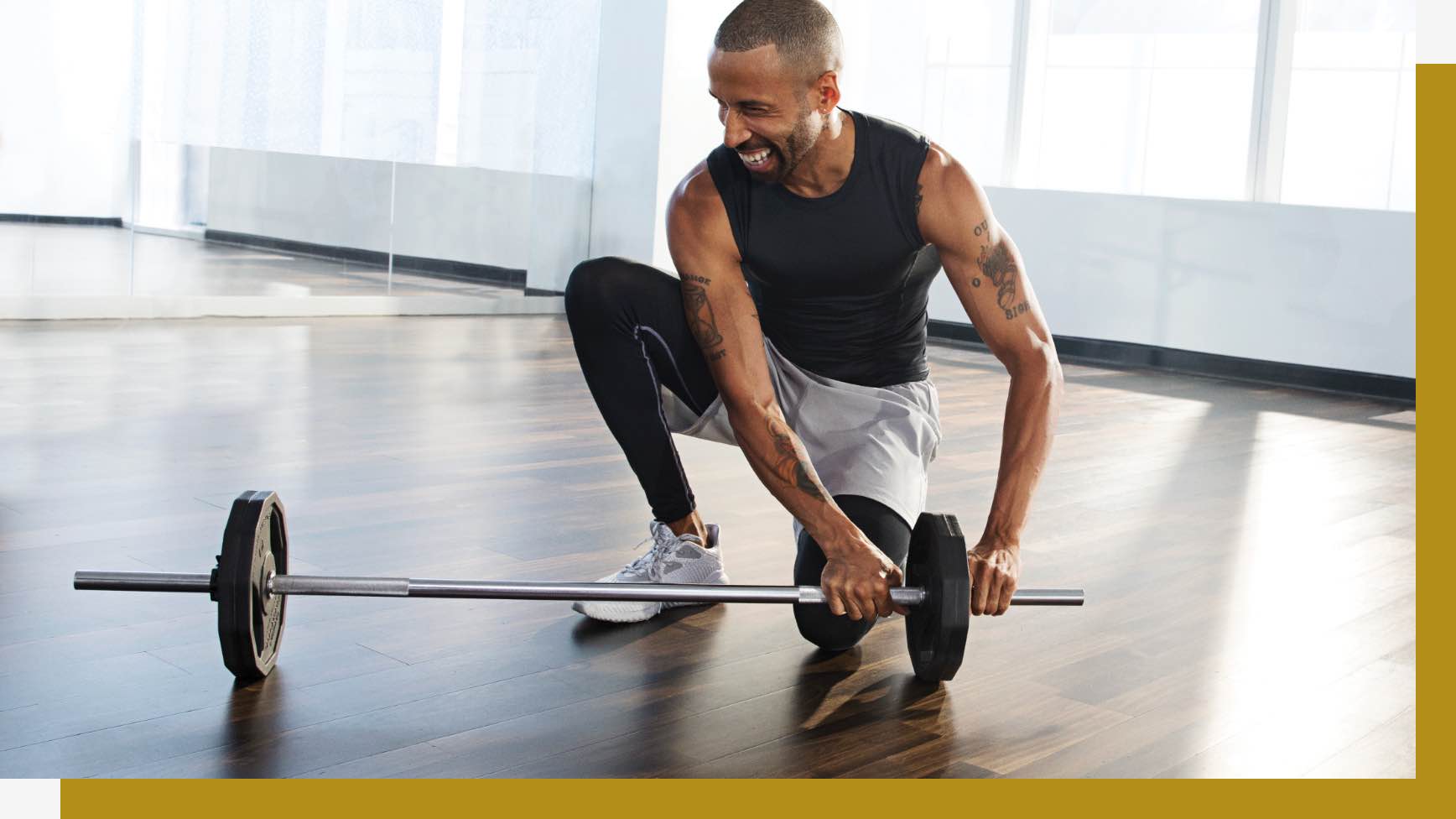 Man putting on weights to a barbell