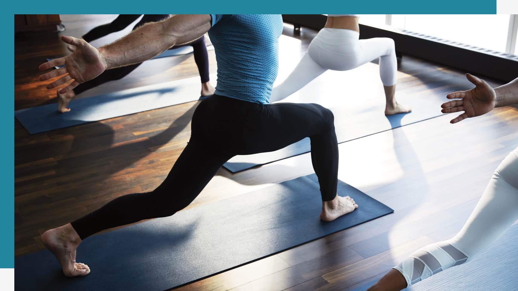 Group of people holding a pose in yoga class
