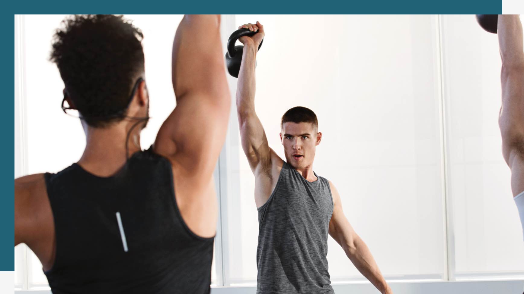 Instructor leading a Kettlebell Kombine class