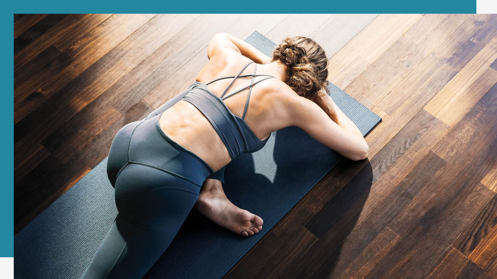 Woman holding a pose in yoga class