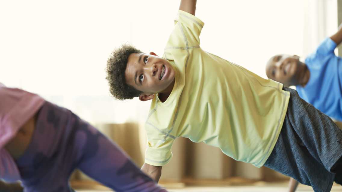 a boy doing yoga