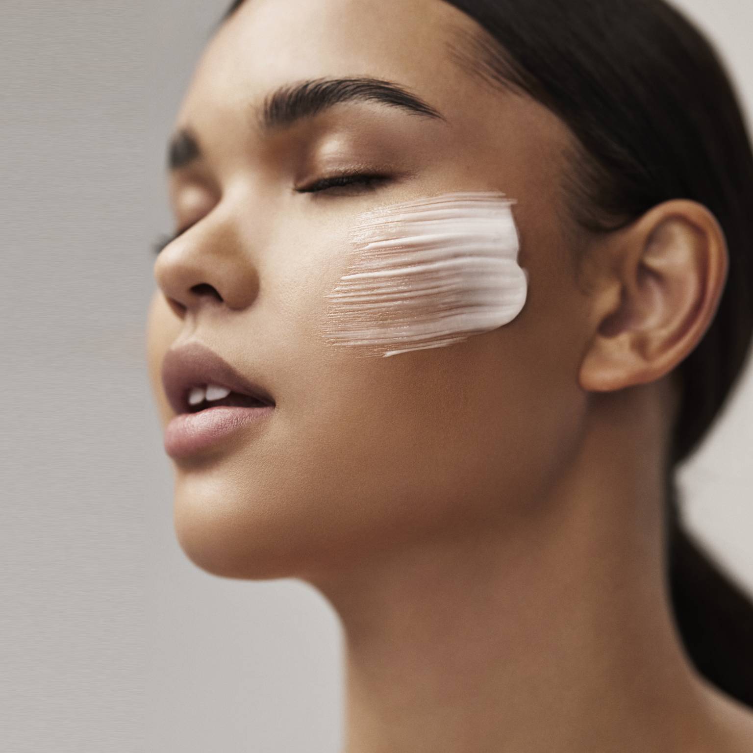 a woman with lotion on her face