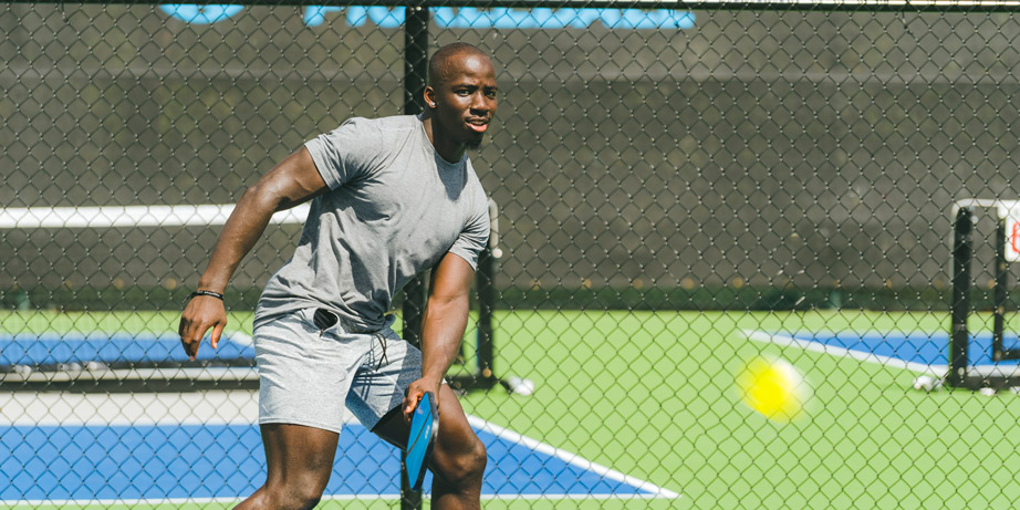 a man serving a pickleball